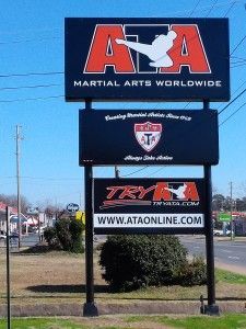 A sign that says martial arts worldwide on it