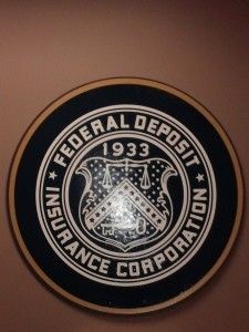 A federal deposit insurance corporation seal from 1933