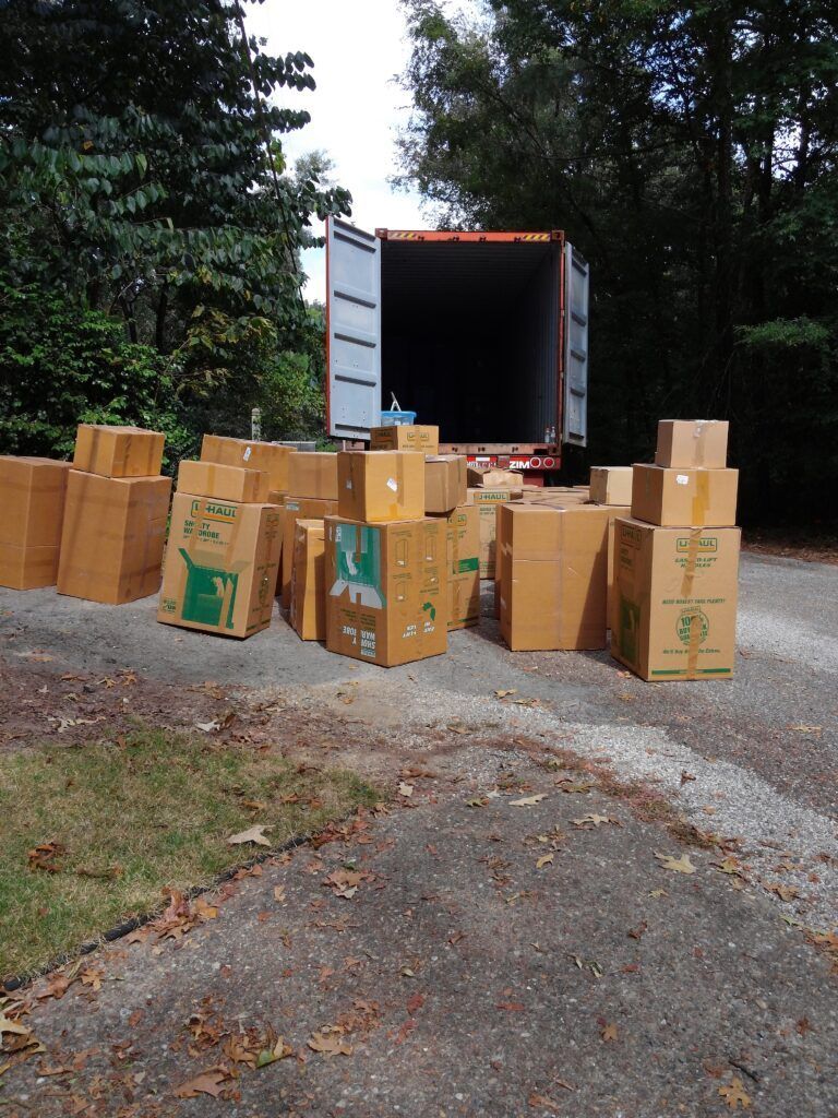 A bunch of cardboard boxes are stacked on top of each other