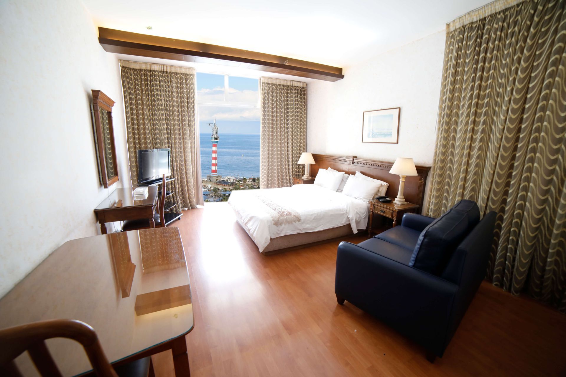 A hotel room with a view of the ocean