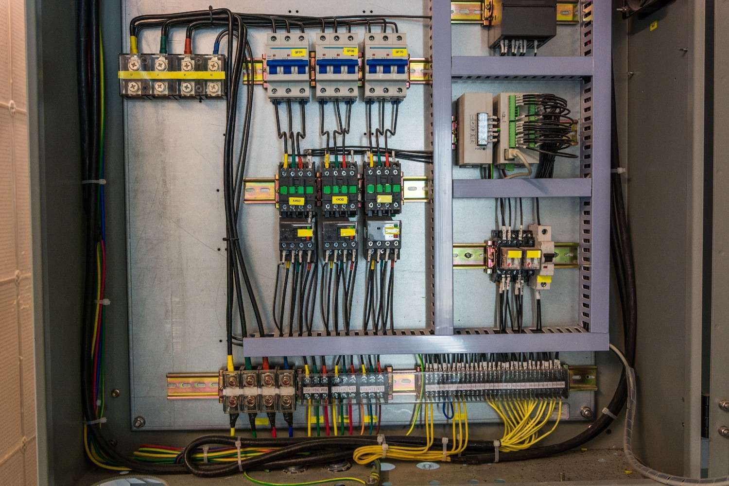 A Electrical Control Panel With Wires, Breakers, and Relays — McGrath Electrical & Data in Ballina, NSW