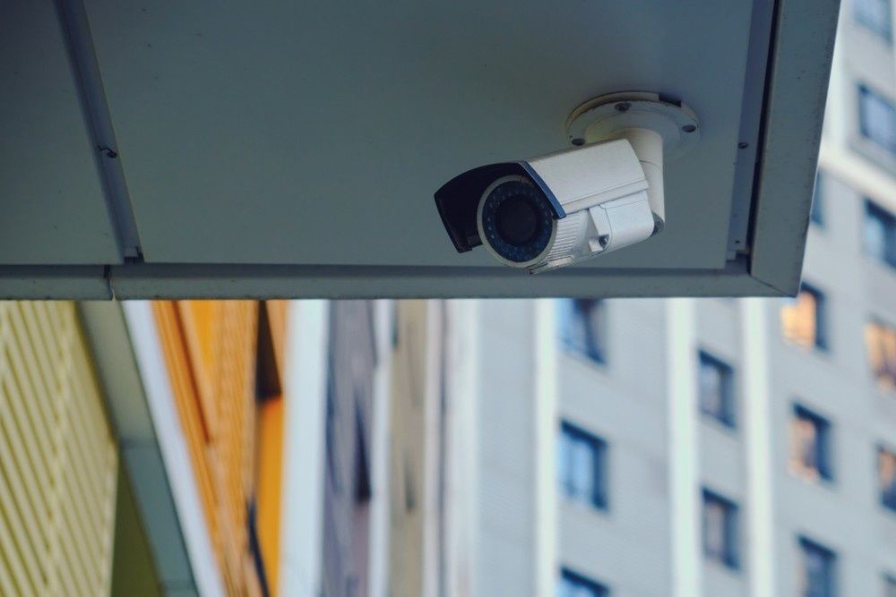 A White Security Camera Mounted Under a Grey Awning — McGrath Electrical & Data in Yamba, NSW