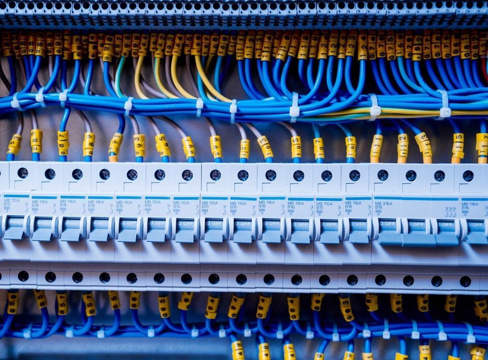 A Electrical Panel With Blue, Yellow, and Black Wires — McGrath Electrical & Data in Ballina, NSW