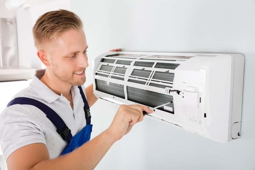 A Man Repair  the Aircon — McGrath Electrical & Data in Casino, NSW