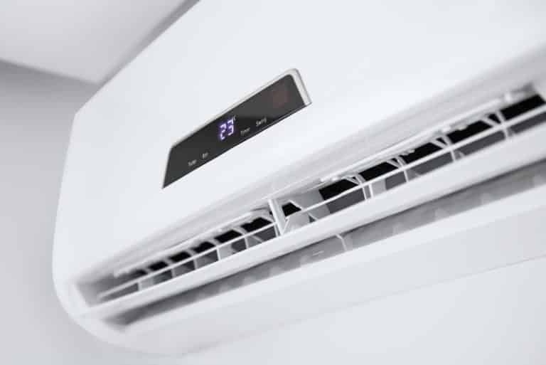 White air conditioner on a white wall