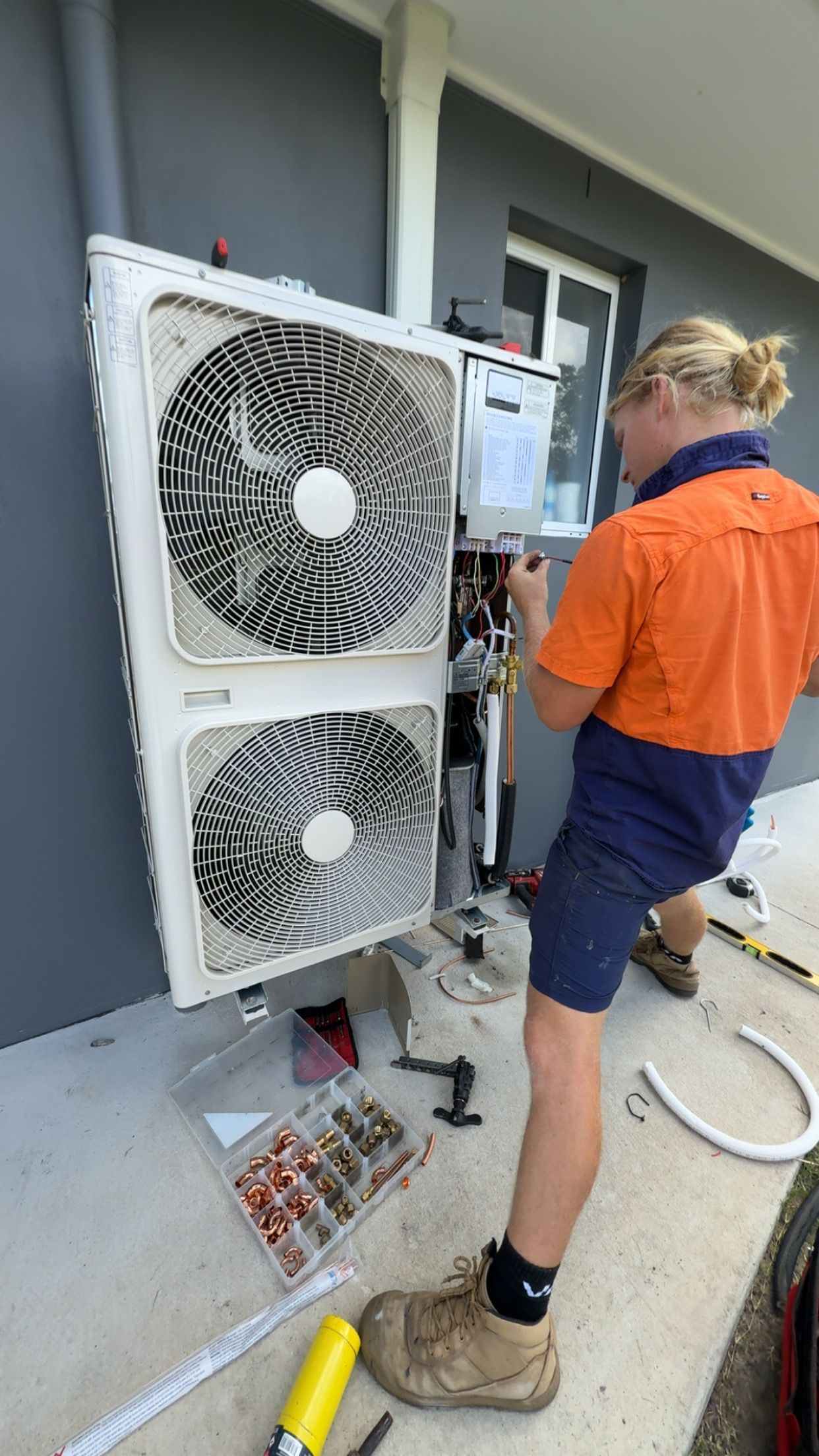 A Two Dismantled Off-white Air Conditioner Parts — McGrath Electrical & Data in South Grafton, NSW
