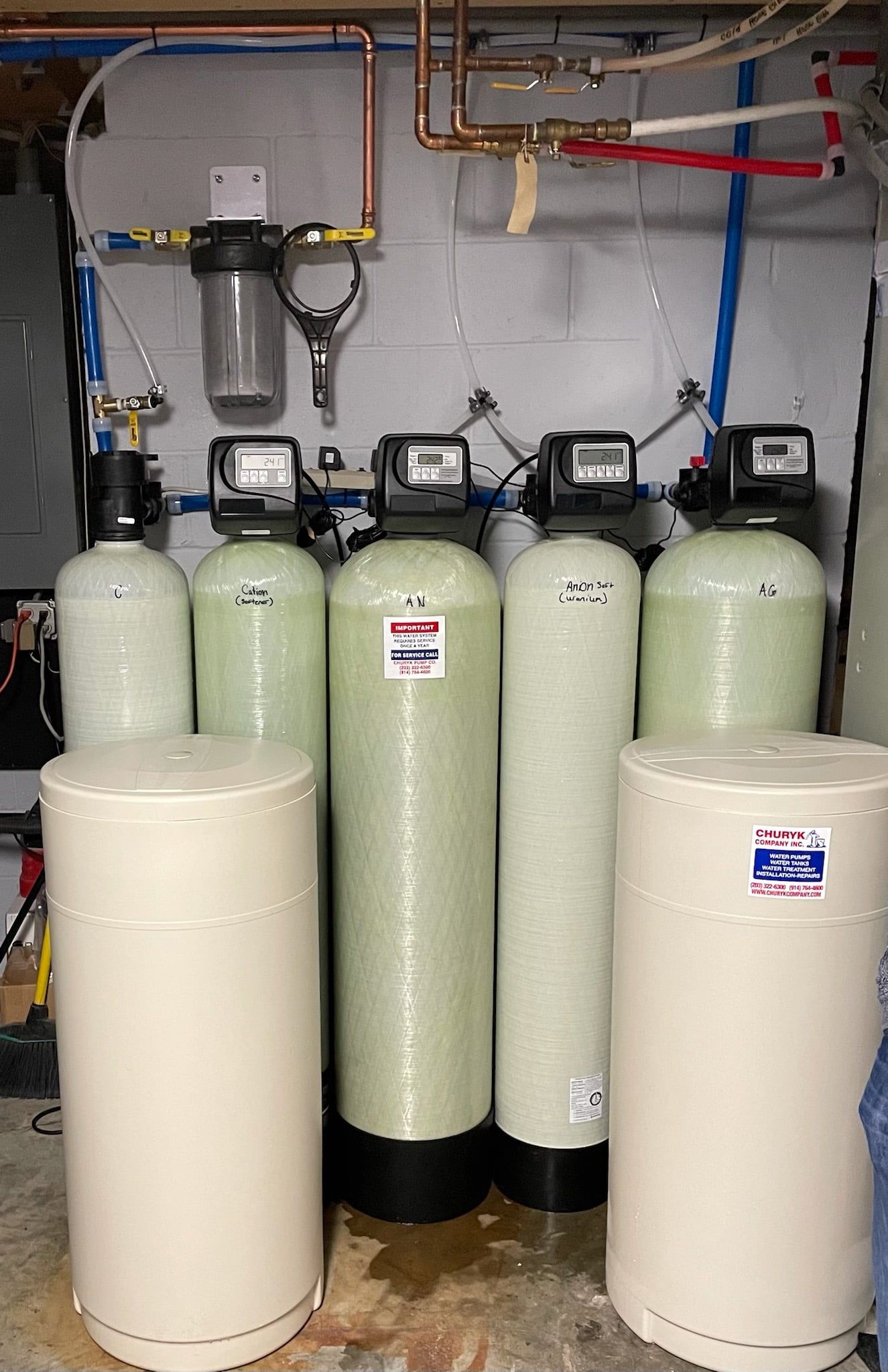A group of water filtration systems are sitting in a room.