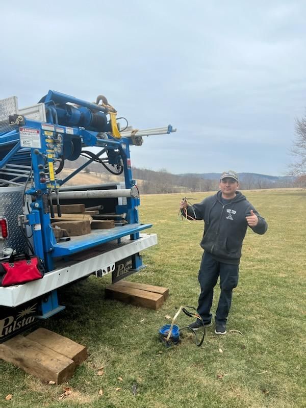 Churyk Team member in front of well systems truck