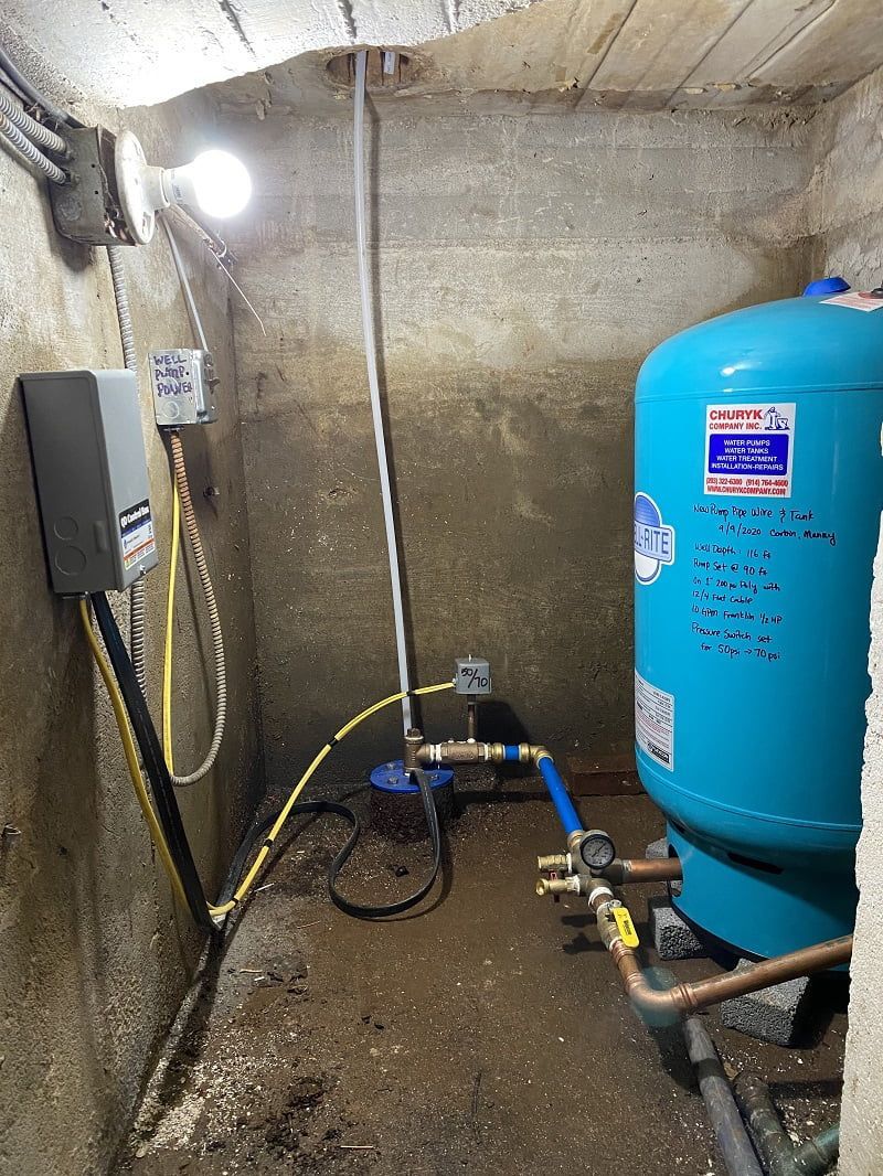 There is a water tank in the corner of the room.