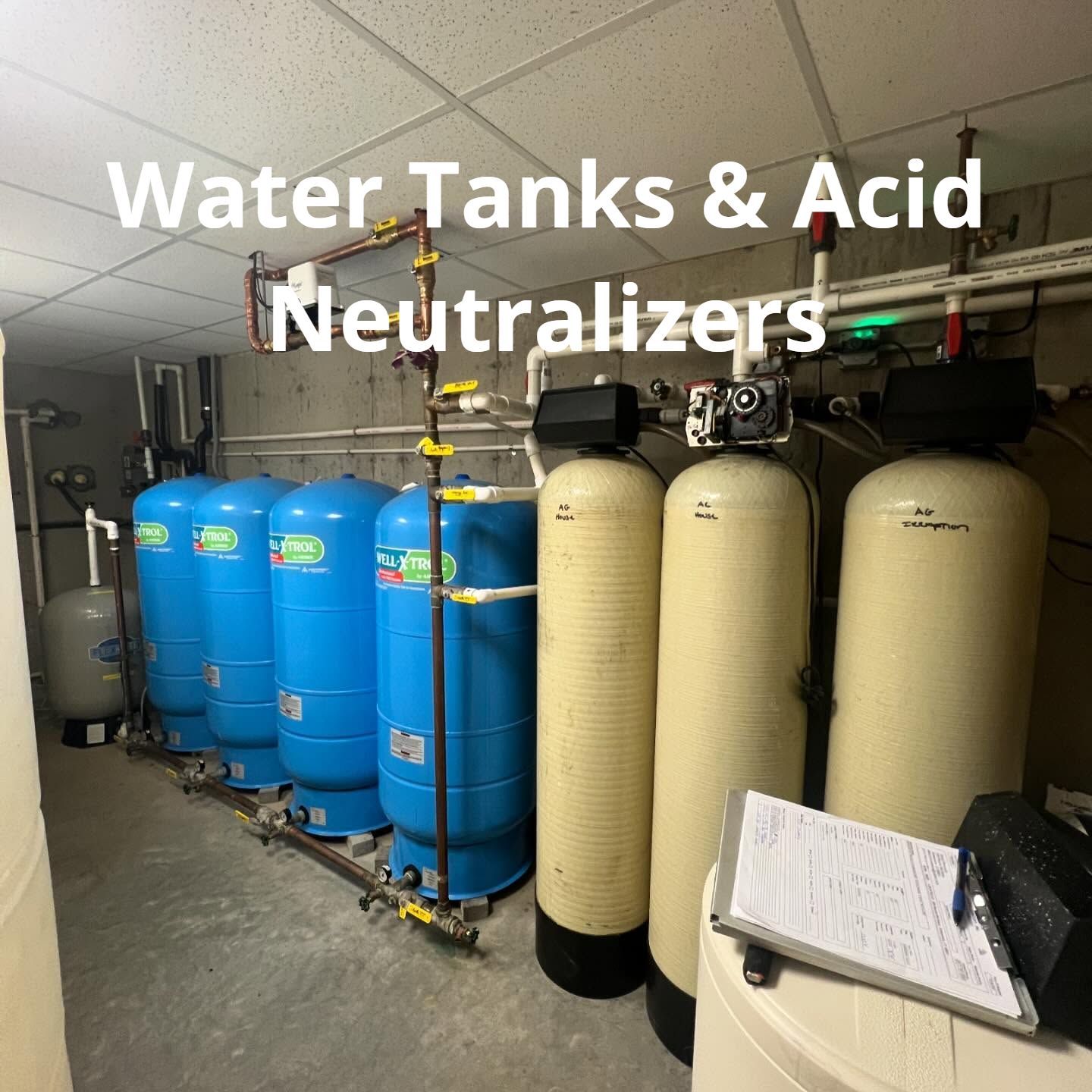 A room filled with water tanks and acid neutralizers