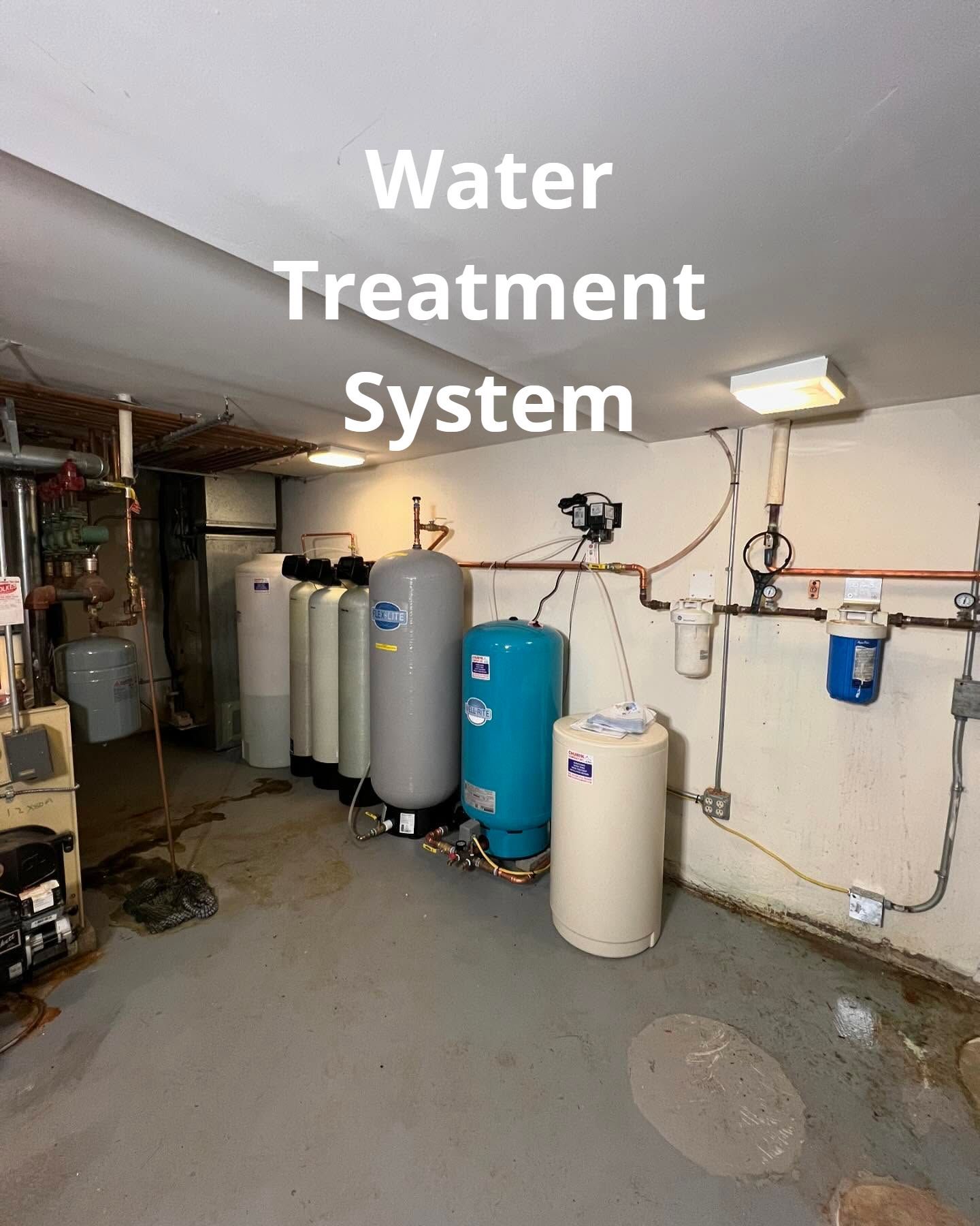 A water treatment system is installed in a basement.