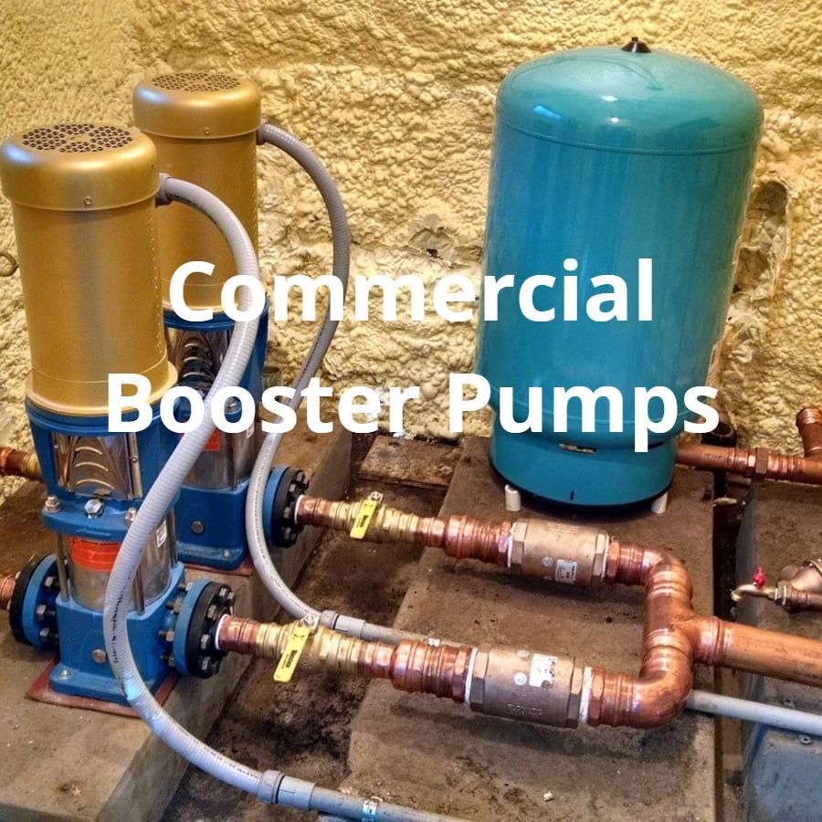 A picture of commercial booster pumps with copper pipes