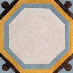 una piastrella a disegni esagonali di color bianco con i bordi di color giallo, marrone e azzurro