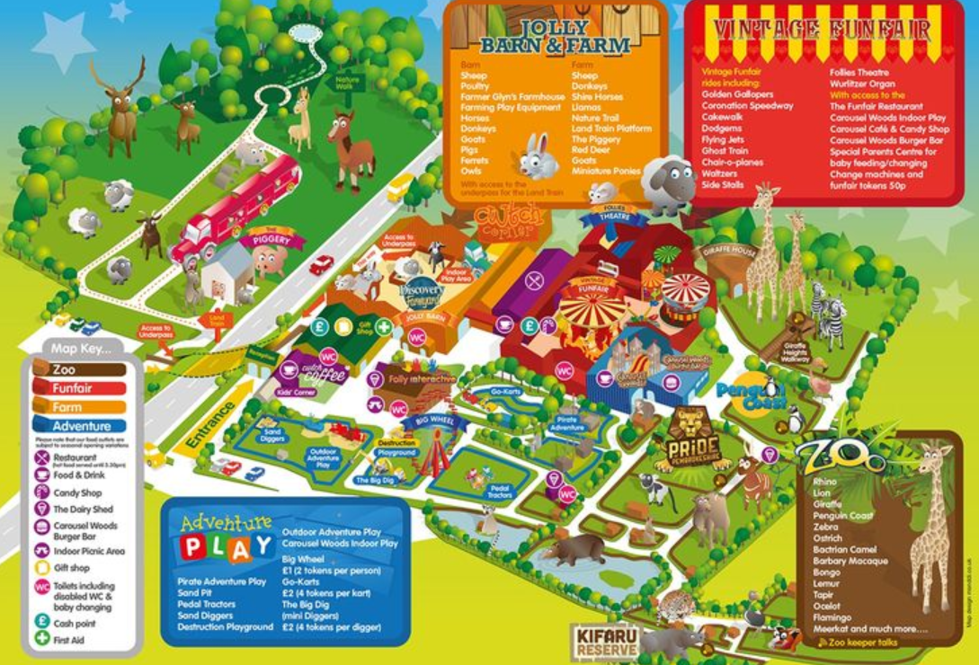 A view of a beach from a hill overlooking the ocean on a sunny day.