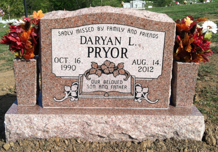 pink headstone with vases