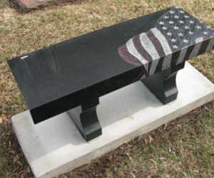 monument bench with american flag engraving