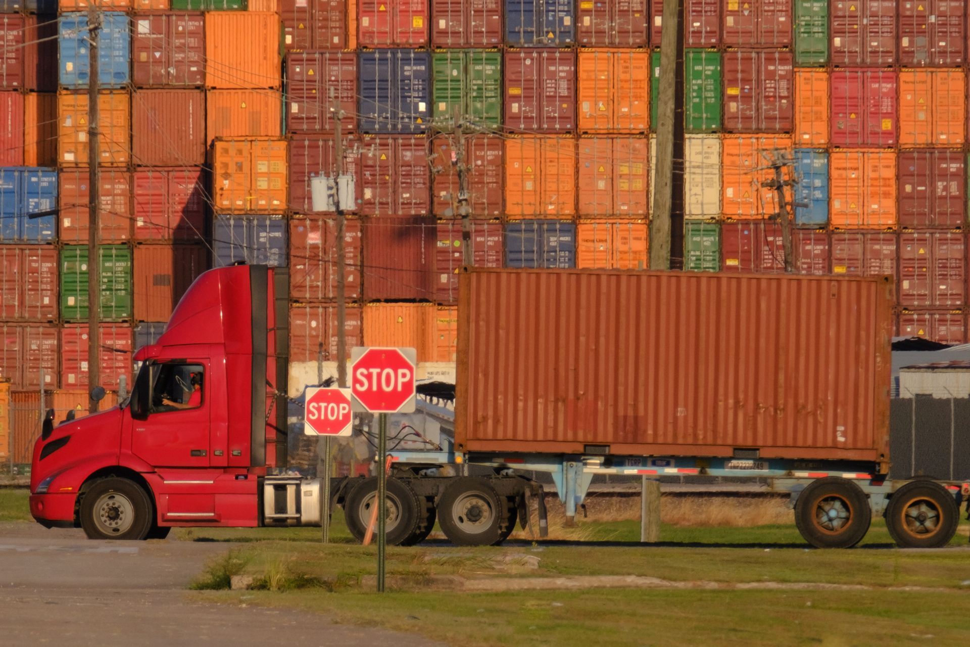 Hands typing on a laptop with overlaid digital supply chain management graphics.