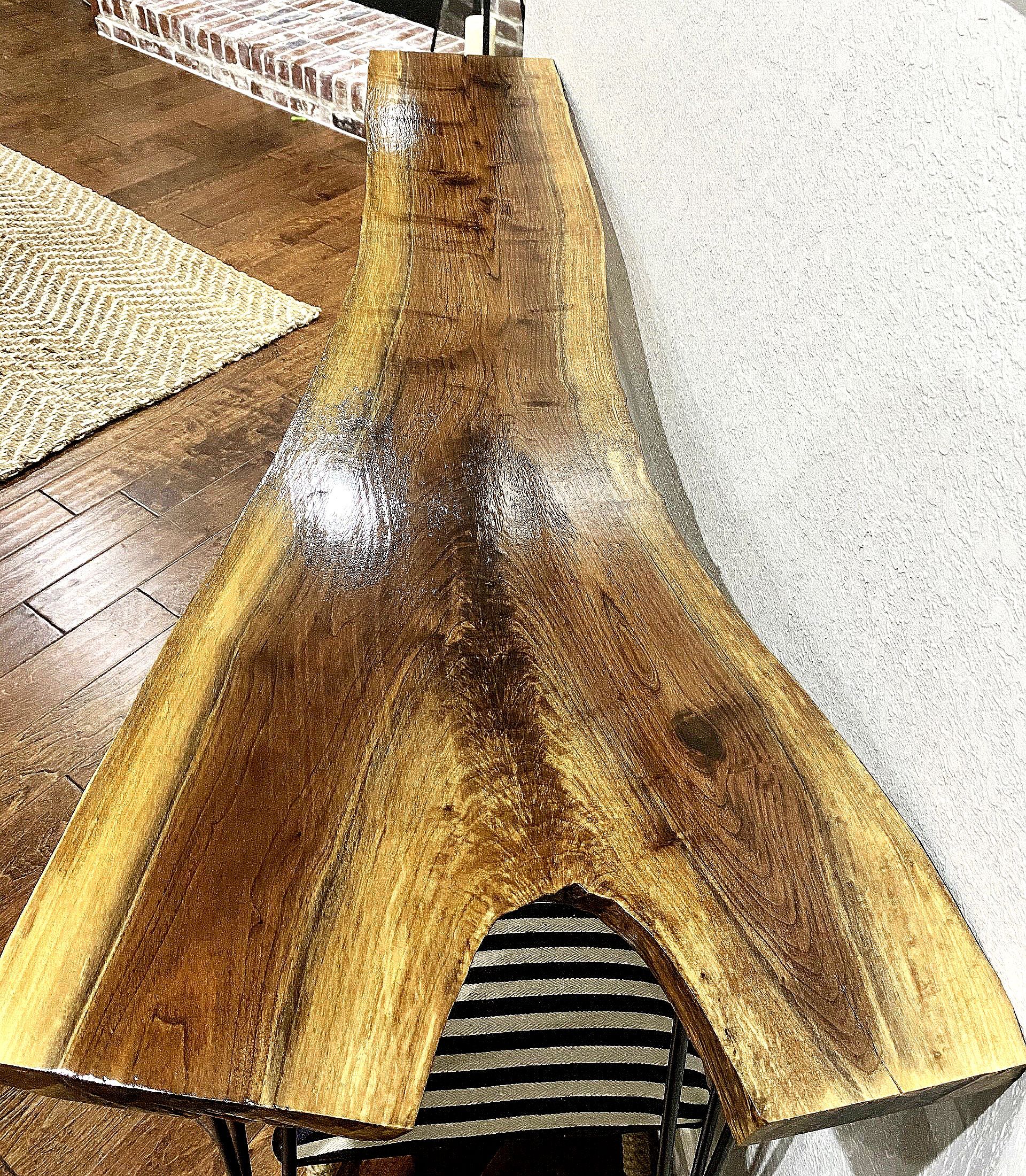 A wooden table is sitting on top of a wooden floor.