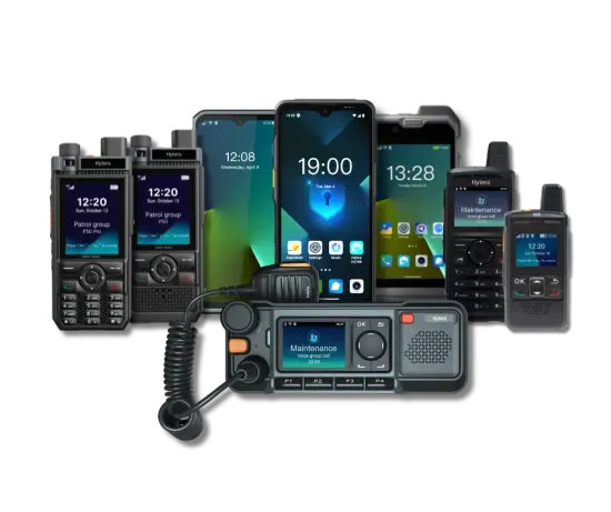A laptop , cell phone , and walkie talkie are sitting next to each other on a table.