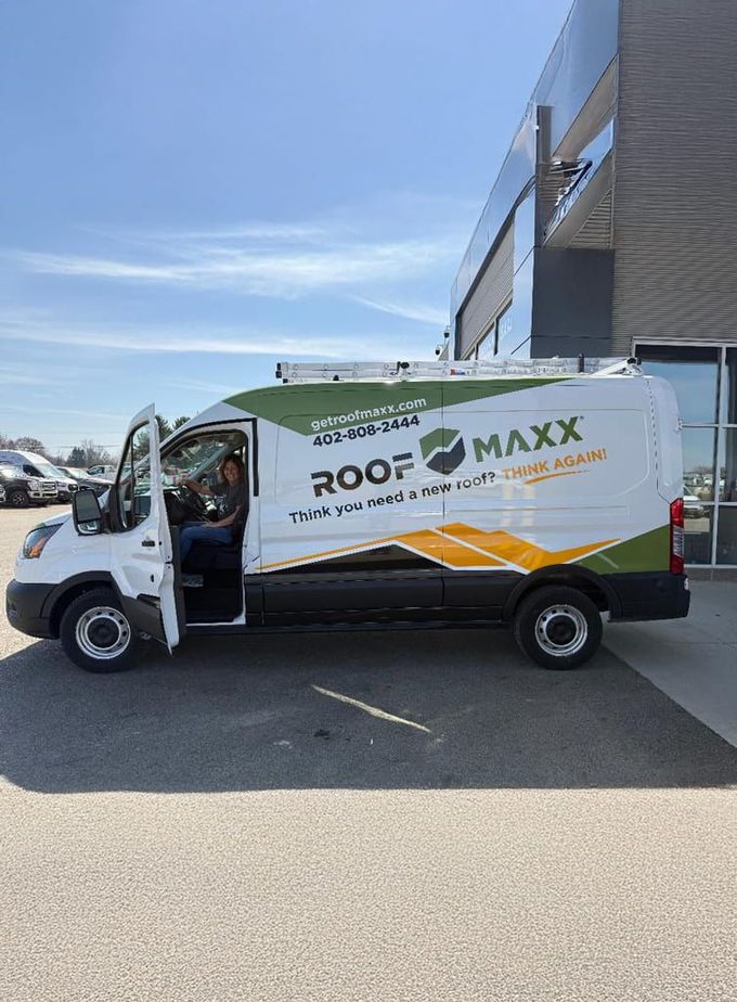 RoofMaxx white and green Car outside