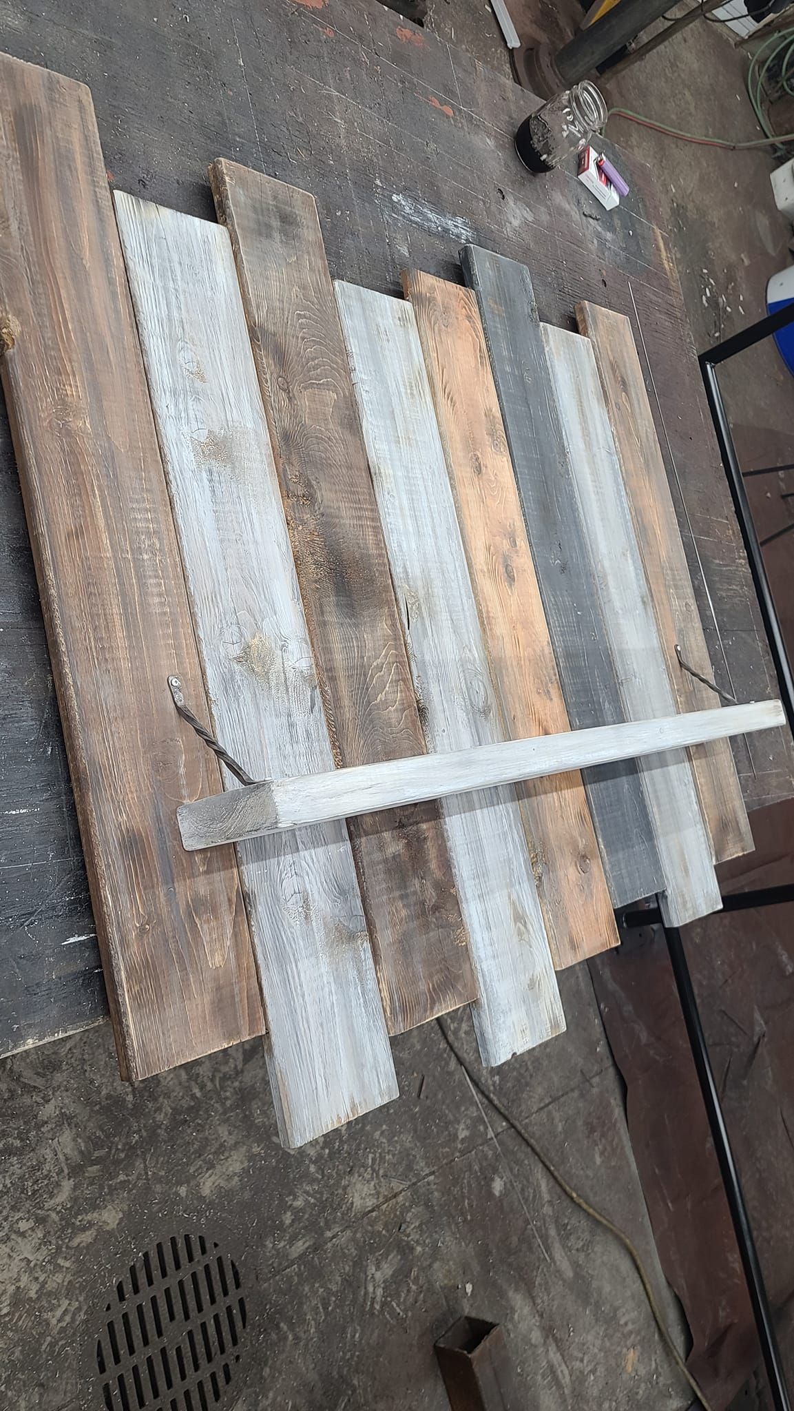 A pile of wooden boards sitting on top of each other on a table.