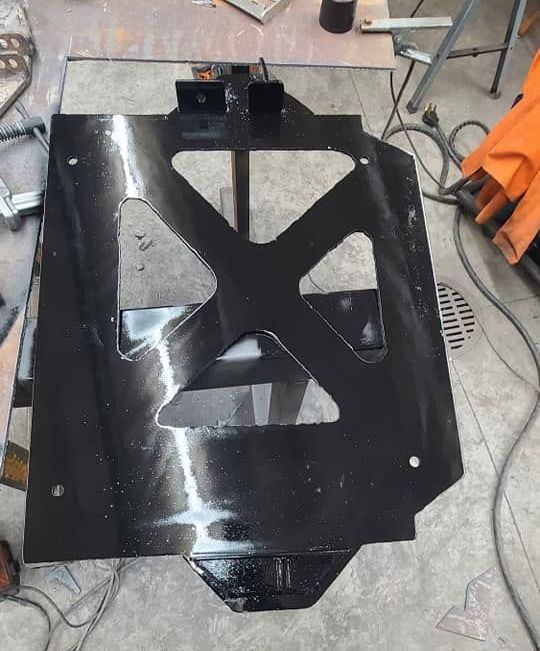 A black metal item is sitting on a table