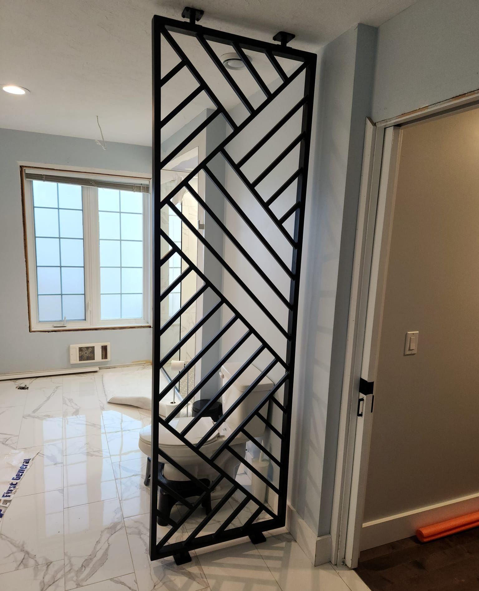 A room divider with a geometric design on it