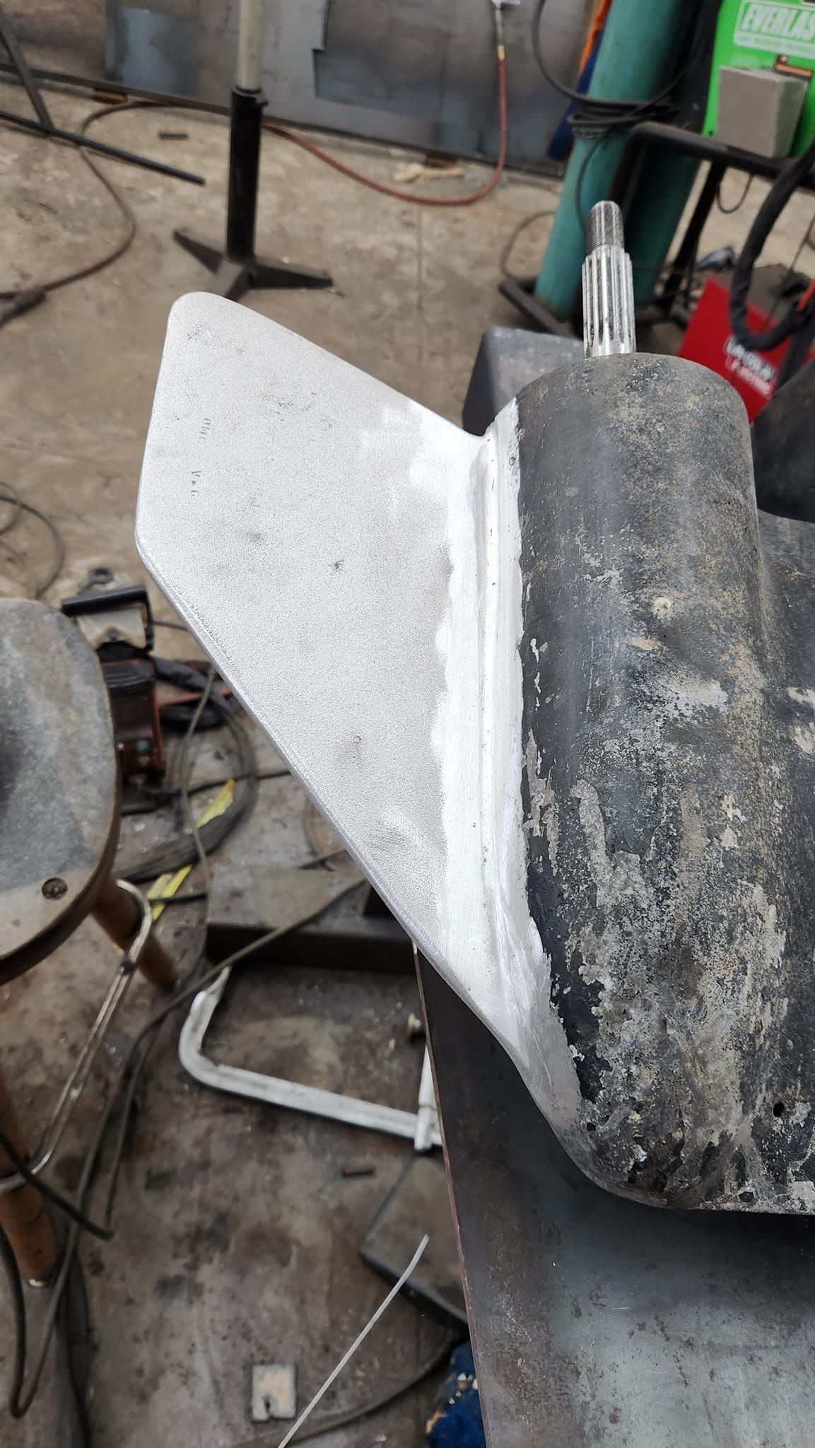 A piece of metal is sitting on top of a table.