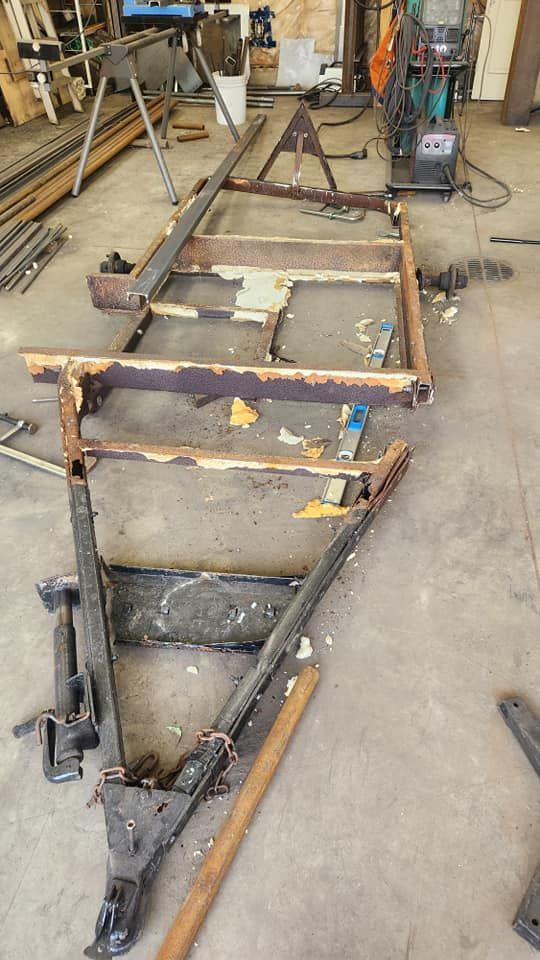 A trailer is being built in a garage.