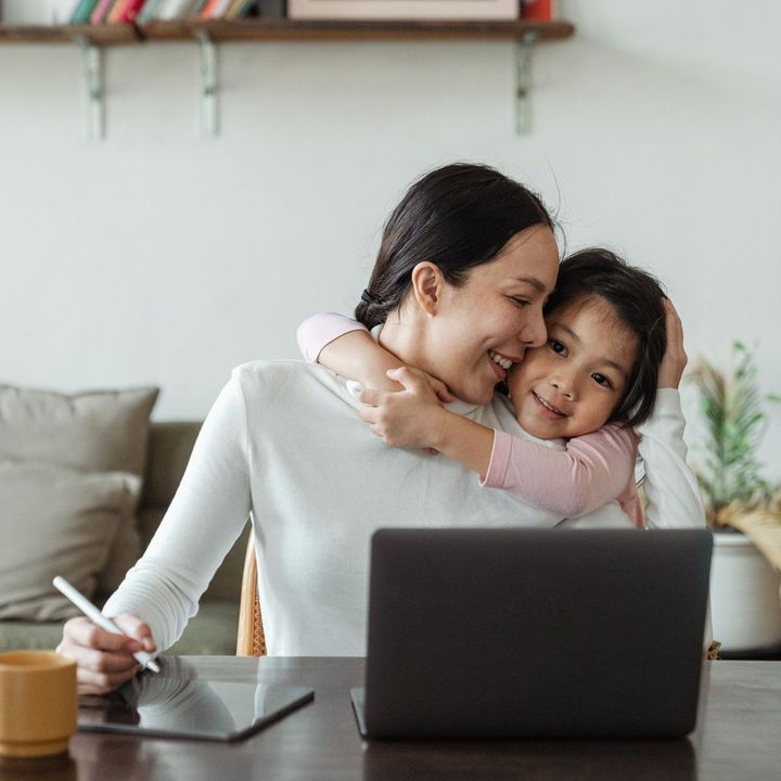 mom and child using laptop