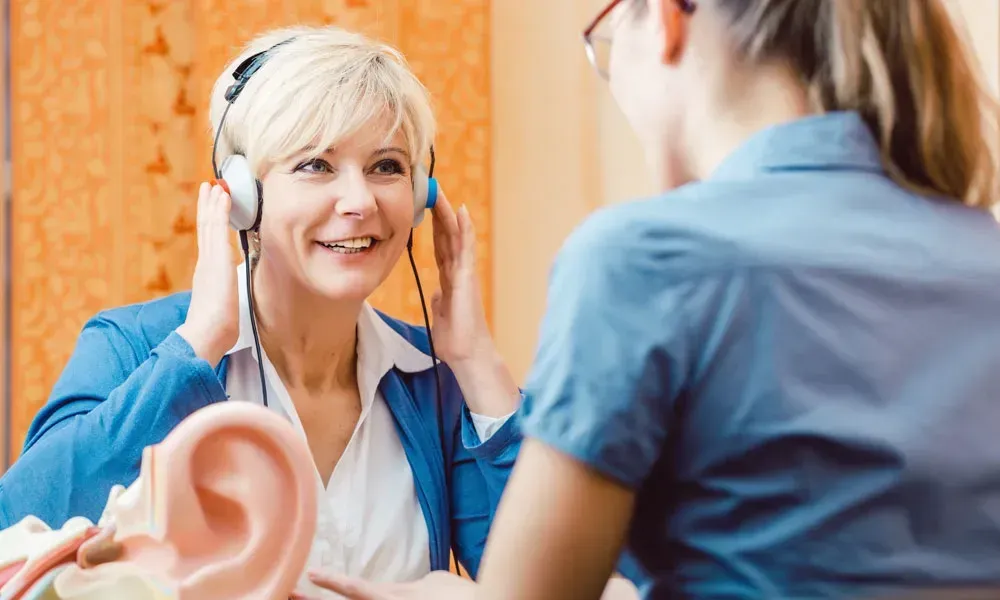 woman getting a hearing test for hearing loss treatment ENT