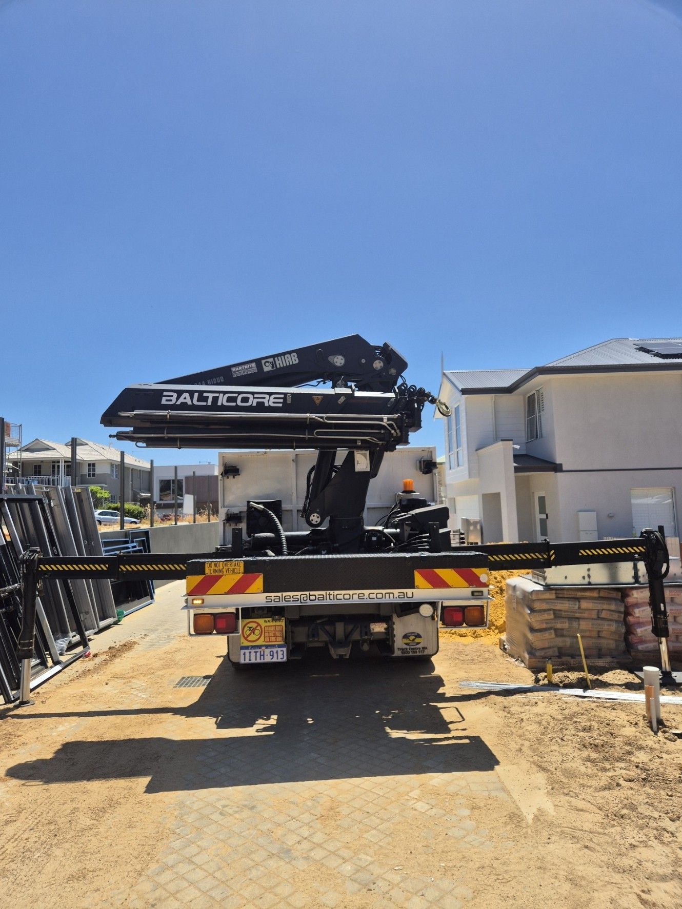 Hiab cranes are working on a construction site.