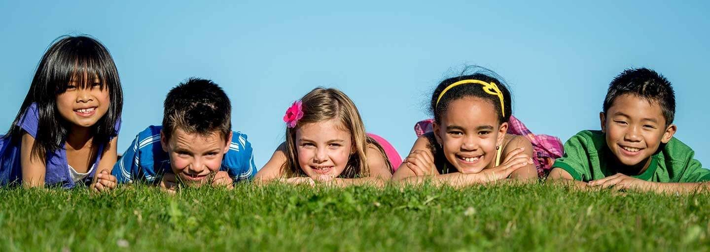 Kids laying on the grass