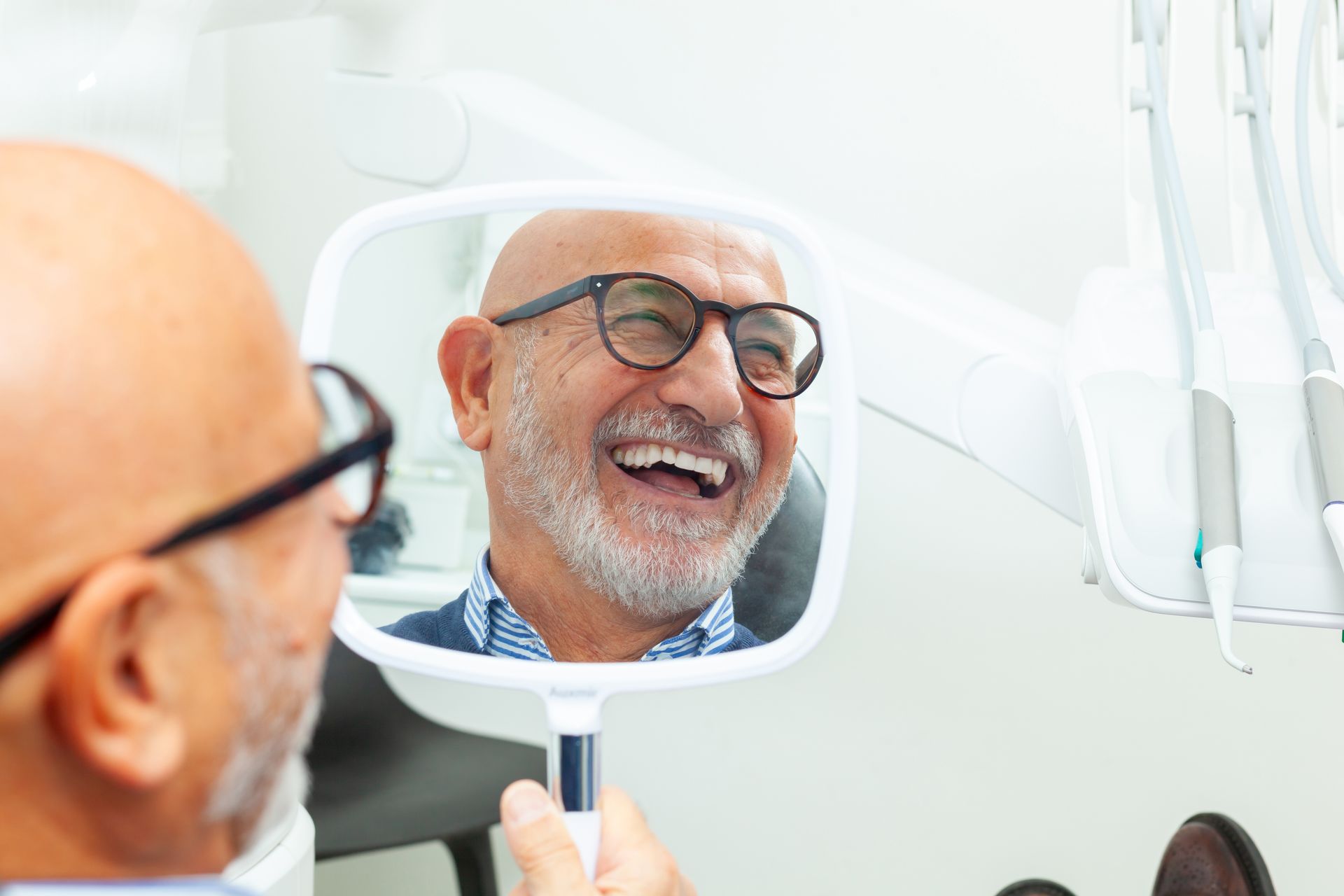 A Person in a Dental Office Smiles While Checking Their Teeth — Killara Dental in East Killara, NSW