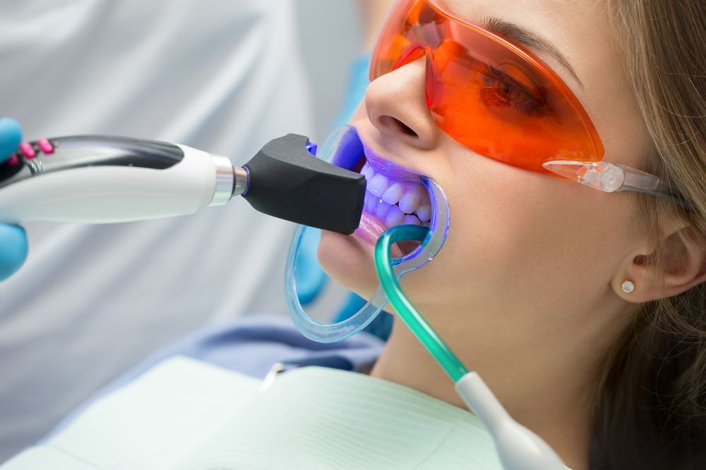 Person Wearing Orange Protective Glasses — Killara Dental in East Killara, NSW