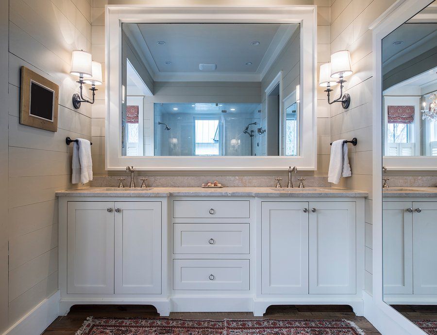 a bathroom with build in cabinets