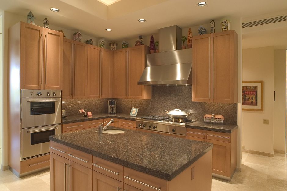 a kitchen with marbled countertops