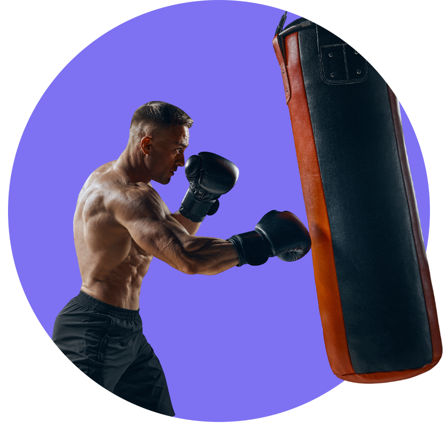 A boxer practicing in red and black punching bag