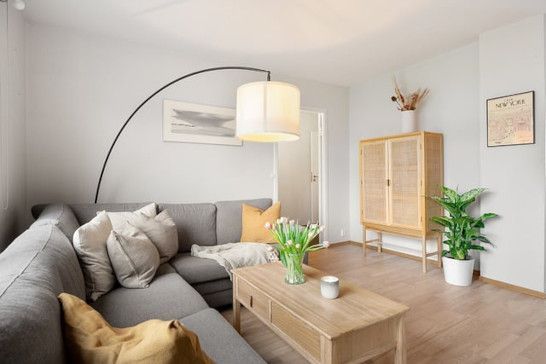 Bedroom with comfortable seating and window treatments