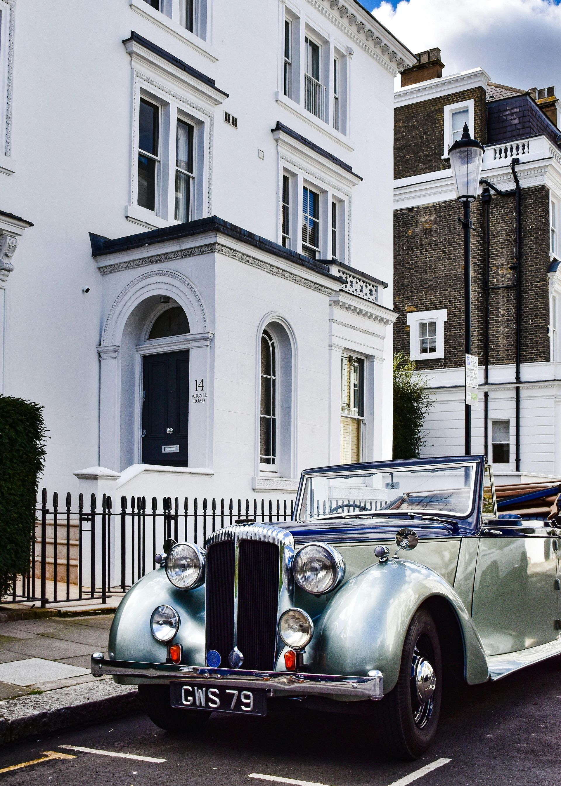 A lovely white painted apartment terrace in Reading, UK. Expert house exterior painting by Snowflake Decor.