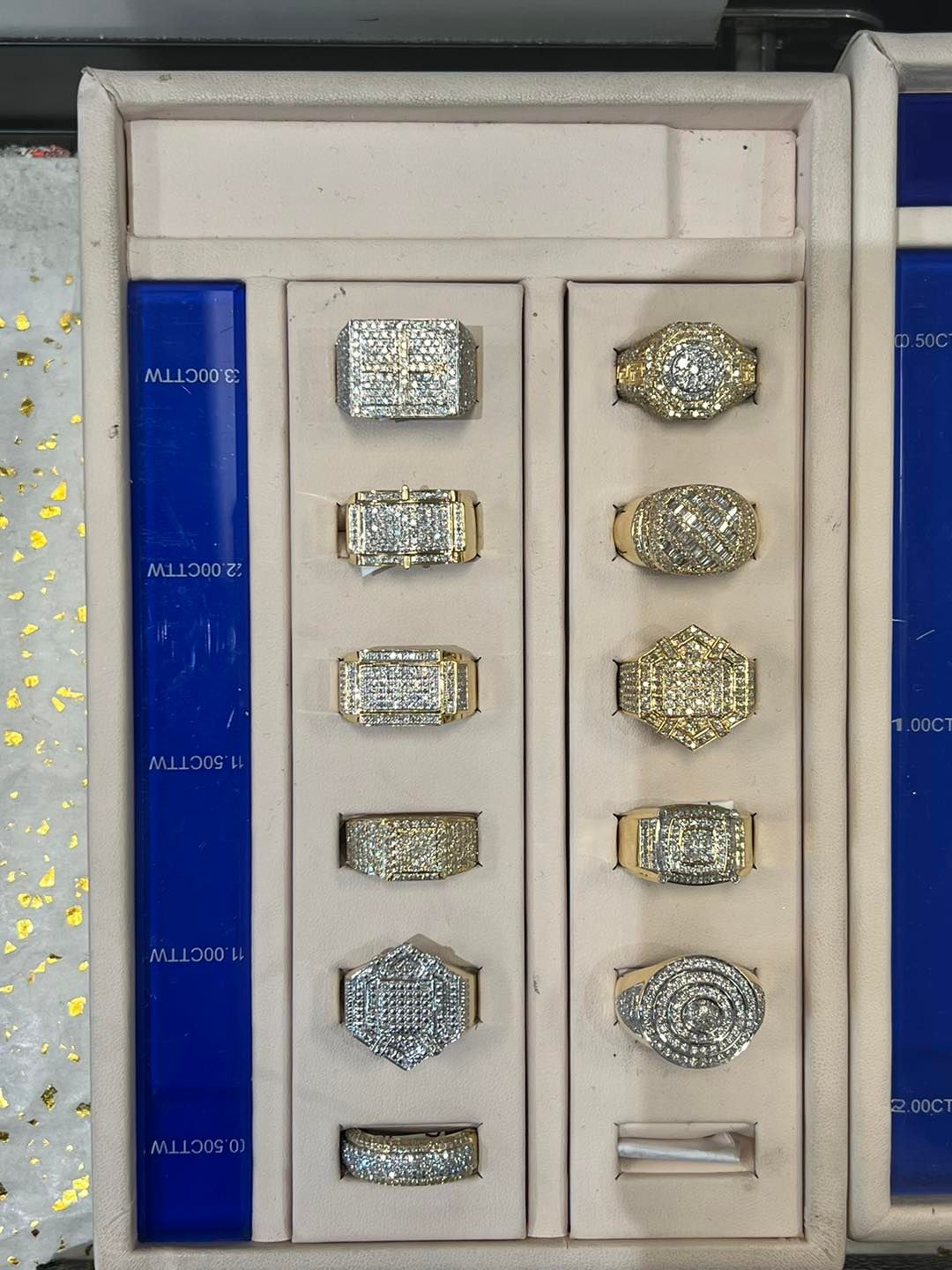 Display case with gold and diamond rings.