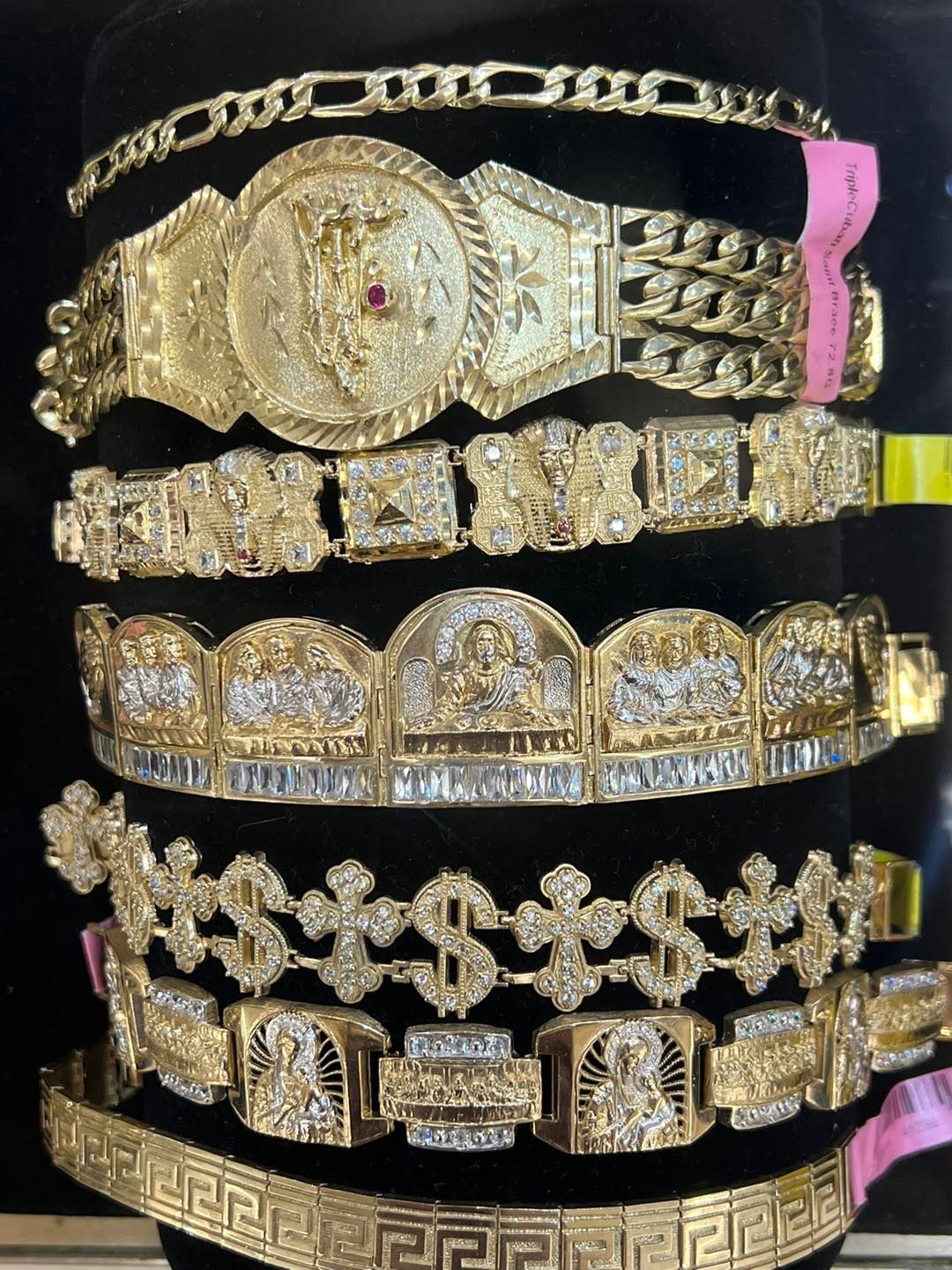 Gold jewelry bracelets on display.