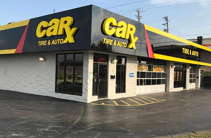 CarX Tire & Auto shop with yellow and black signage. Exterior shot.
