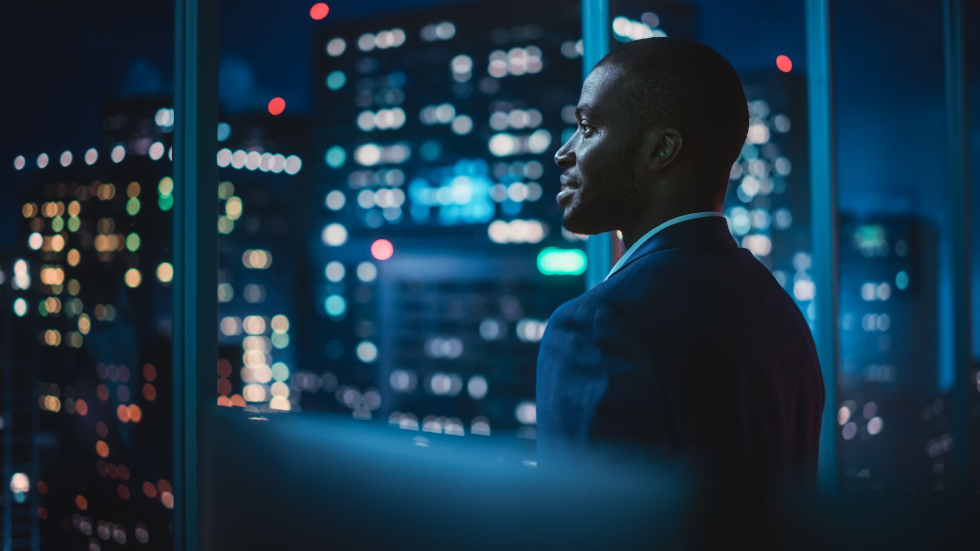 A businessman looking out on a window