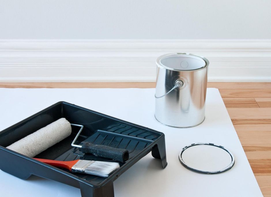 a paint bucket and other tools for painting