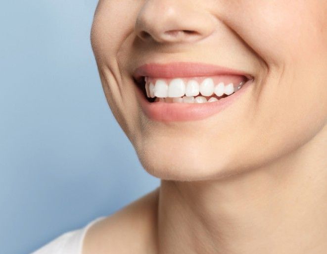 A Before and After Picture of a Person Teeth — ProCare Dental Australia in East Maitland, NSW