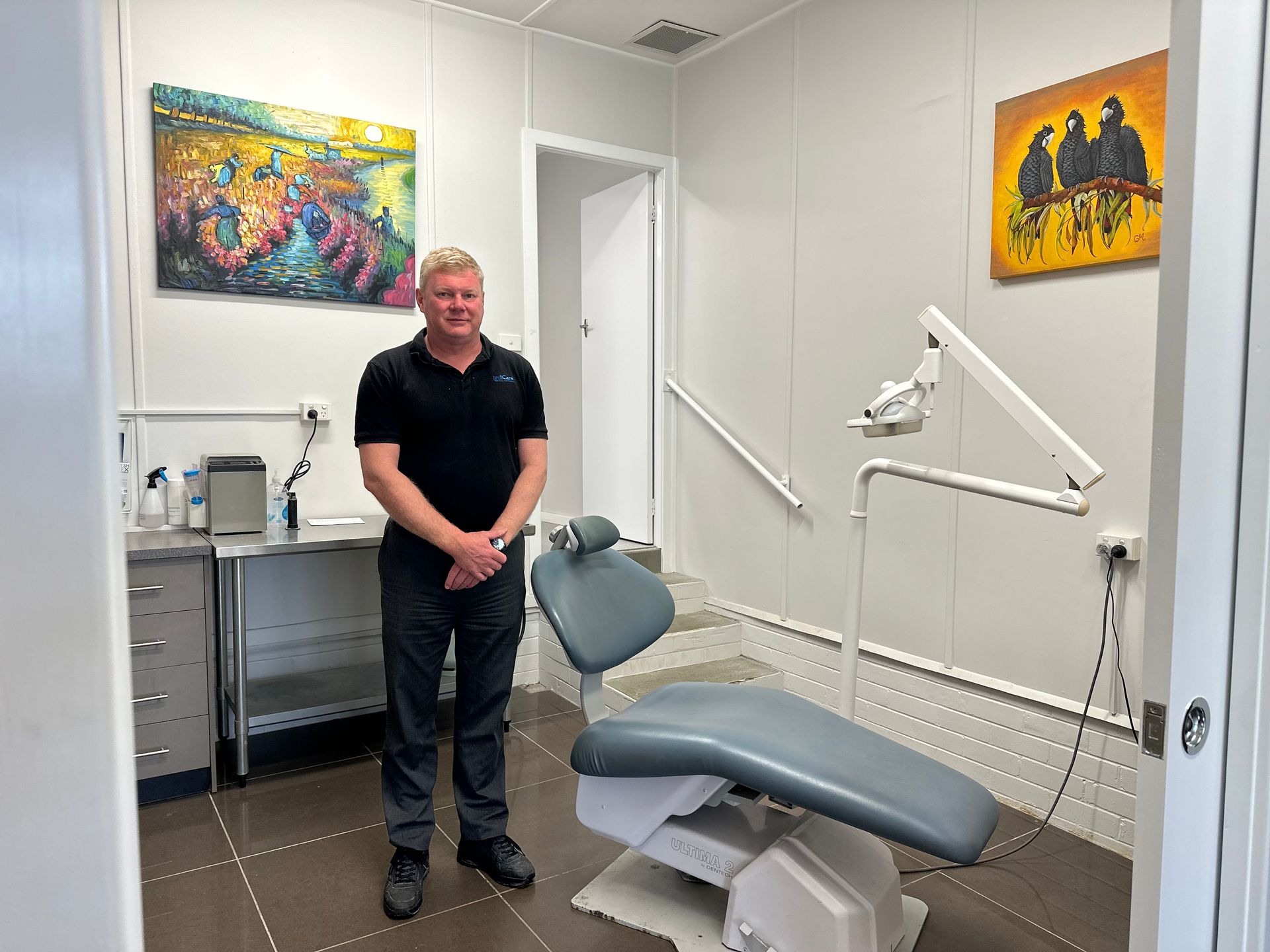 A Female Dentist is Working on a Denture in a Dental Office — ProCare Dental Australia in East Maitland, NSW