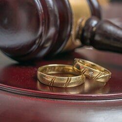 Golden rings and gavel — Attorney Services in Mineola, NY Golden rings and gavel — Attorney Services in Mineola, NY