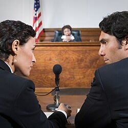 A lawyer and defendant talking — Attorney Services in Mineola, NY A lawyer and defendant talking — Attorney Services in Mineola, NY