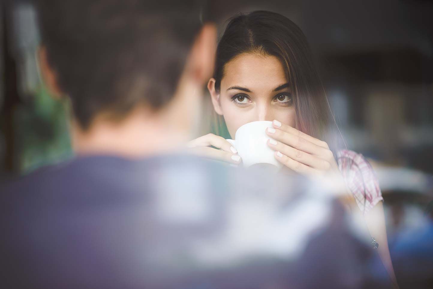 Person on a first date during a divorce drinking a coffee.
